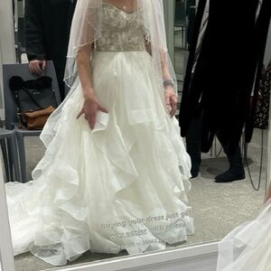 Beautiful brand new Off white David’s bridal wedding gown. Originally $1800.
